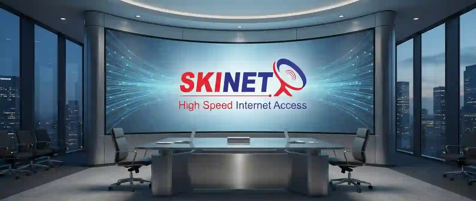 Tampilan layar besar di ruang konferensi perusahaan yang menampilkan logo dan infrastruktur jaringan Internet Dedicated Simetris SKINET untuk korporasi